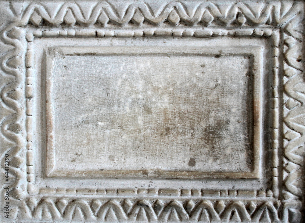 Old marble slab with carved frame