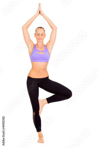 full-length portrait of woman working yoga exercise tree-pose
