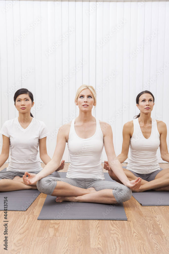 Interracial Group of Three Beautiful Women In Yoga Position Interracial Group of Three Beautiful Women In Yoga Position