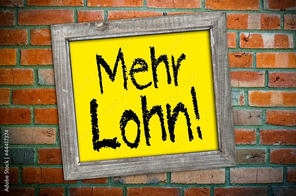 Fototapeta premium Ziegelsteinmauer mit Schild und Lohn