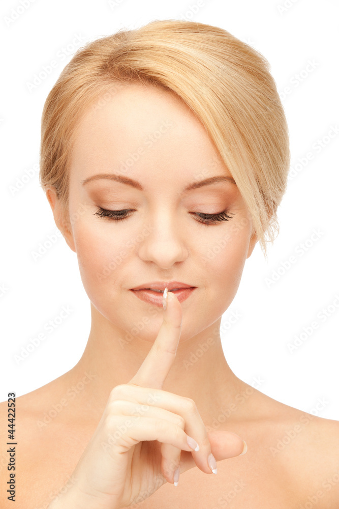 woman with finger on lips