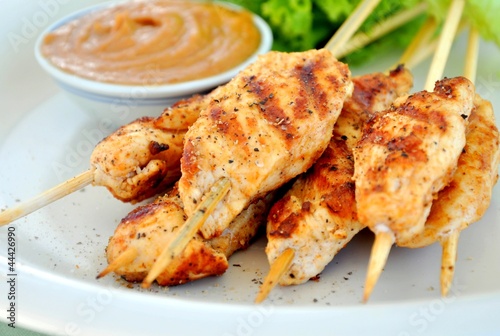Grilled chicken skewers with peanut butter sauce