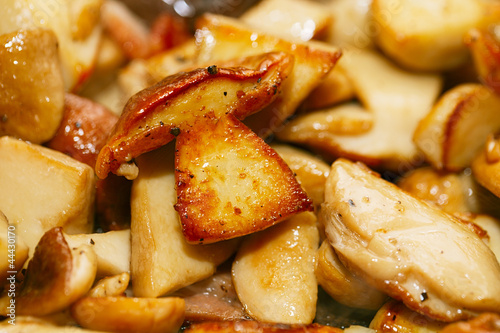 Vászonkép frying white boletus mushrooms in a pan, shallow dof