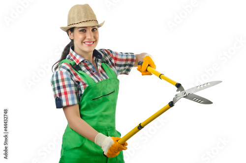 Girl with garden scissors on white