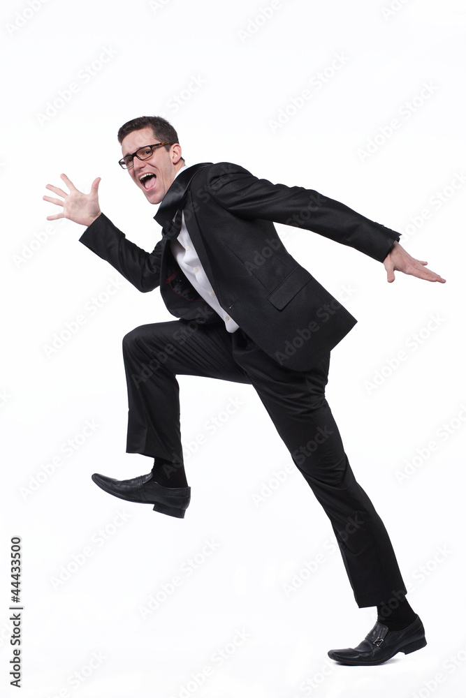 Businessman runs in black suit on white. Businessman runs in black suit on white.