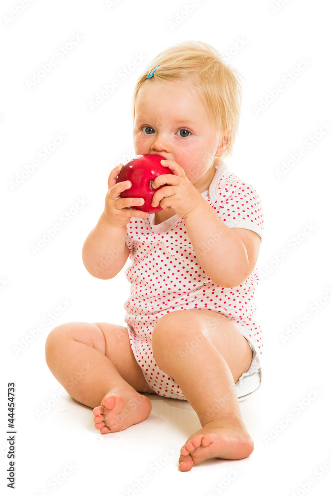 Cute infant girl learining to eat with spoon Cute infant girl learining to eat with spoon