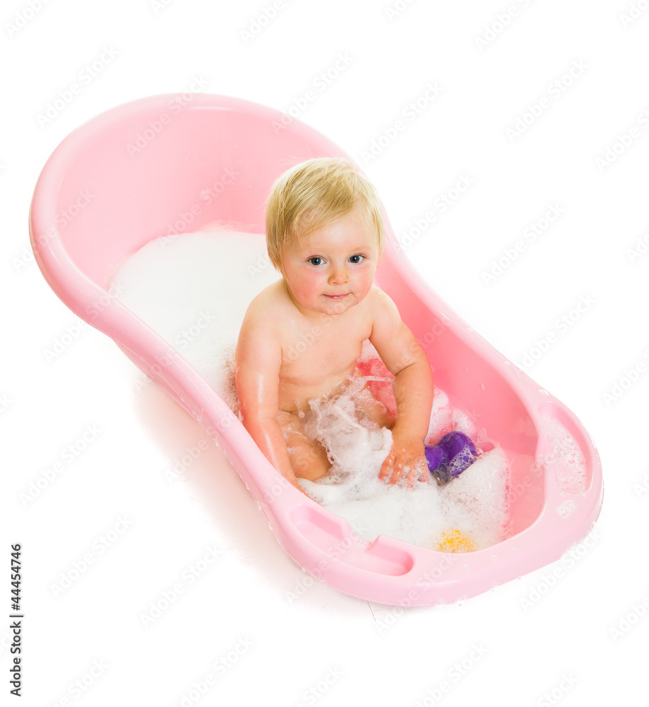 Cute infant girl in bath isolated on white Cute infant girl in bath isolated on white