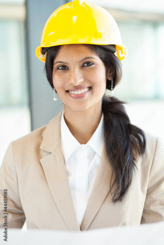pretty young female construction worker in office pretty young female construction worker in office