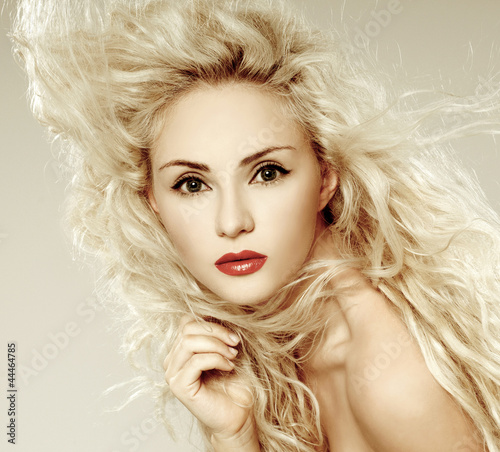 beautiful blonde, heavily madeup red lipstick