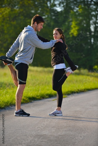 Couple doing stretching exercise  after jogging © .shock