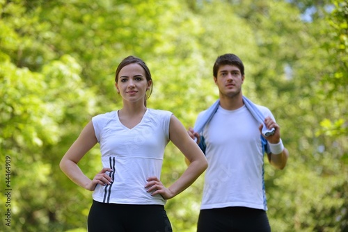 Fototapeta Naklejka Na Ścianę i Meble -  Couple doing stretching exercise  after jogging