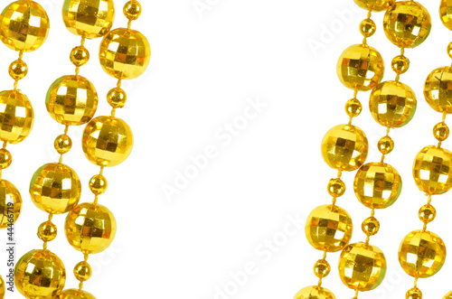 Background made of a brilliant celebratory beads of golden color