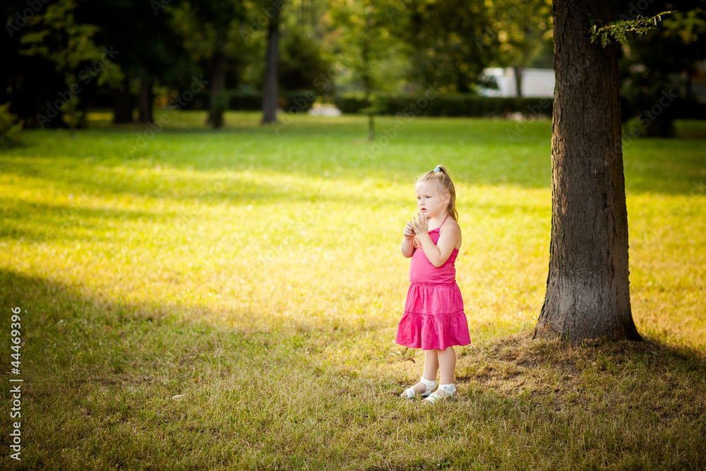 Beautiful little girl in a park Beautiful little girl in a park