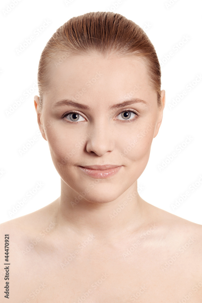 Beautiful woman's face with clean skin - isolated on white Beautiful woman's face with clean skin - isolated on white