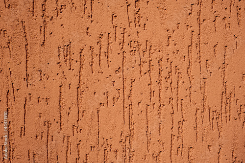 Fotografia red striated stucco wall texture