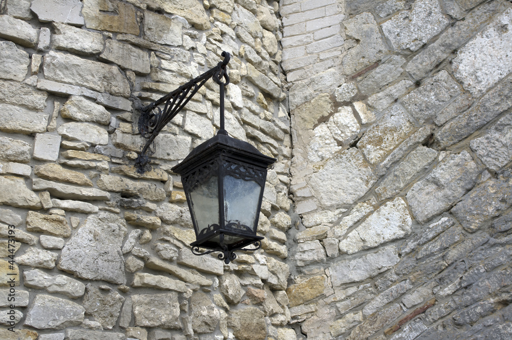old lamp on a fortress wall