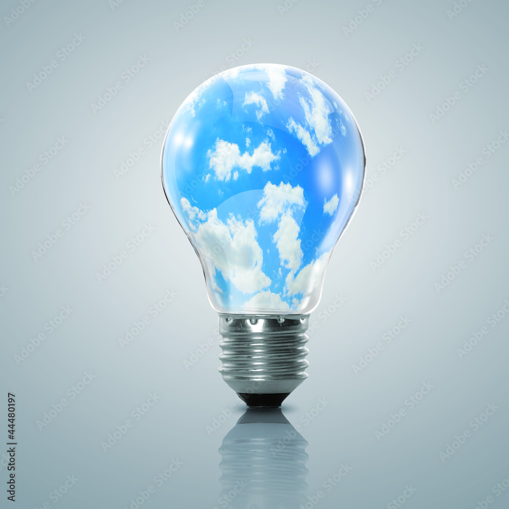 Electric light bulb and blue sky inside it Electric light bulb and blue sky inside it