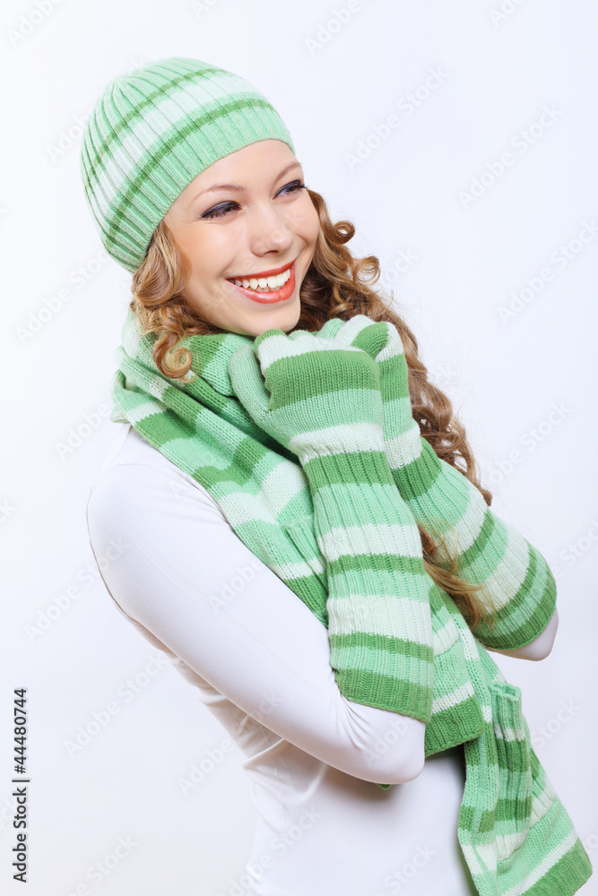 Young woman wearing winter hat and warm scarf Young woman wearing winter hat and warm scarf