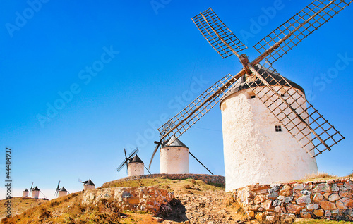 Famous windmills in Consuegra at sunset, Andalusia, Spain photo