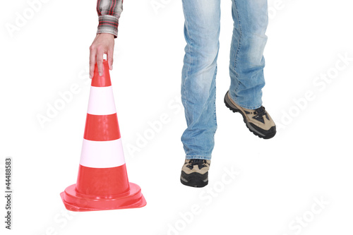 Setting down a traffic pylon