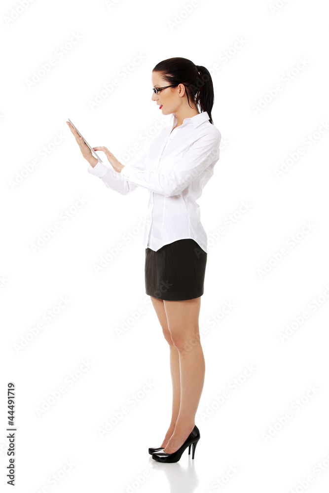 Business woman holding tablet PC with touchpad. Business woman holding tablet PC with touchpad.