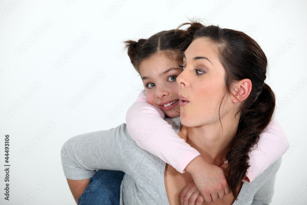 Child riding piggyback Child riding piggyback