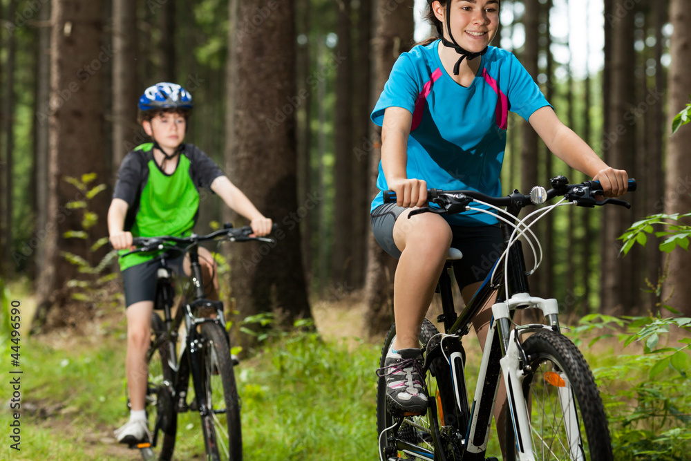 Girl and boy cycling Girl and boy cycling