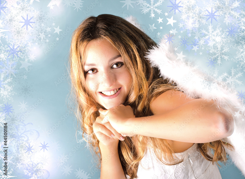 Lovely blond angel with stars and snowflakes Lovely blond angel with stars and snowflakes