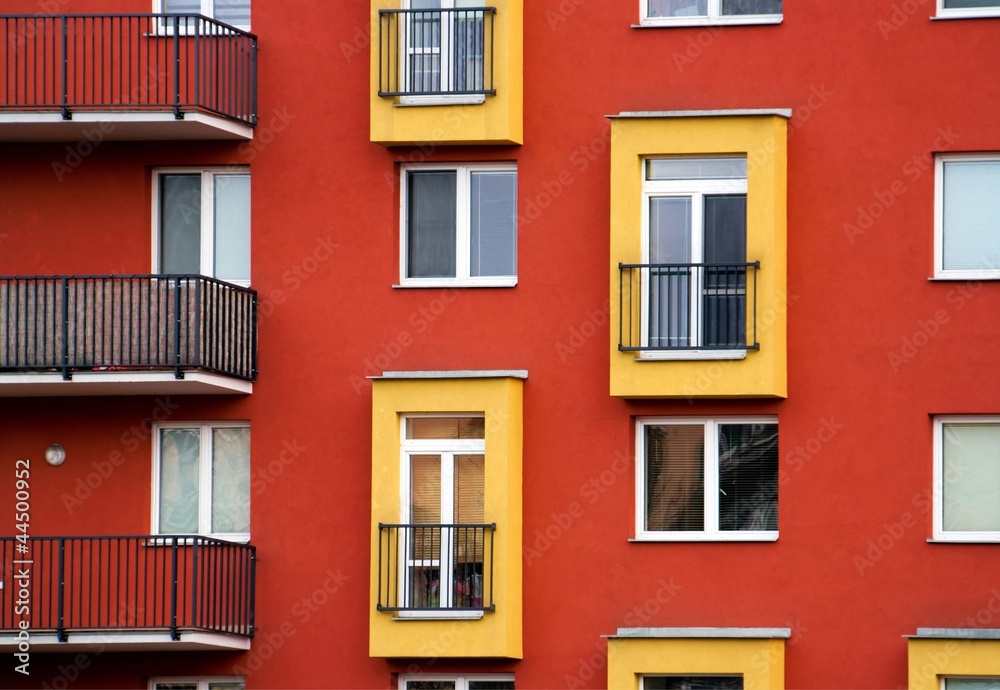 Fototapeta premium Detail of modern apartments with balconies and red walls