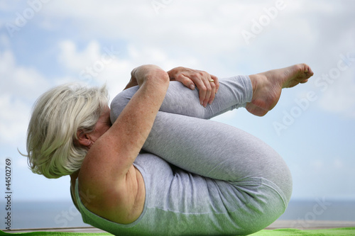Fotografie Woman holding a yoga position