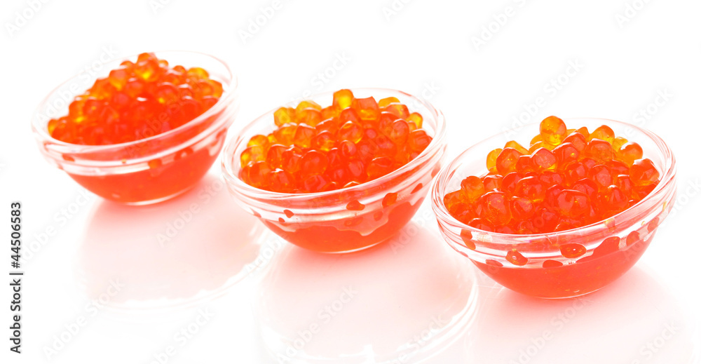 Red caviar in glass bowls isolated on white Red caviar in glass bowls isolated on white