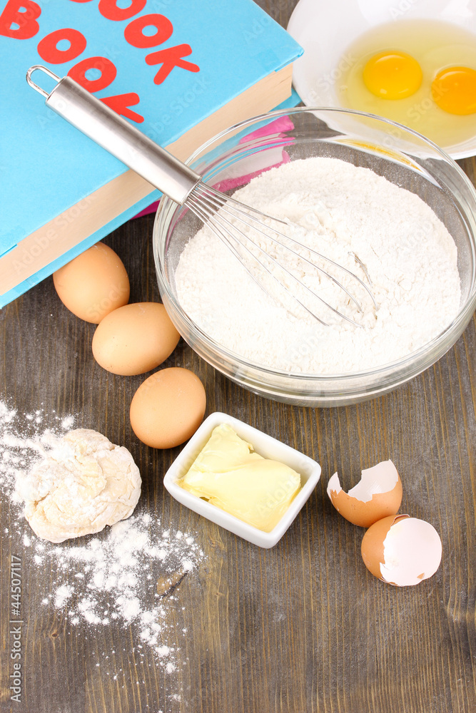 Eggs, flour and butter close-up on wooden table Eggs, flour and butter close-up on wooden table