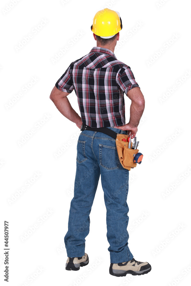 Laborer standing on white background, back-view Laborer standing on white background, back-view