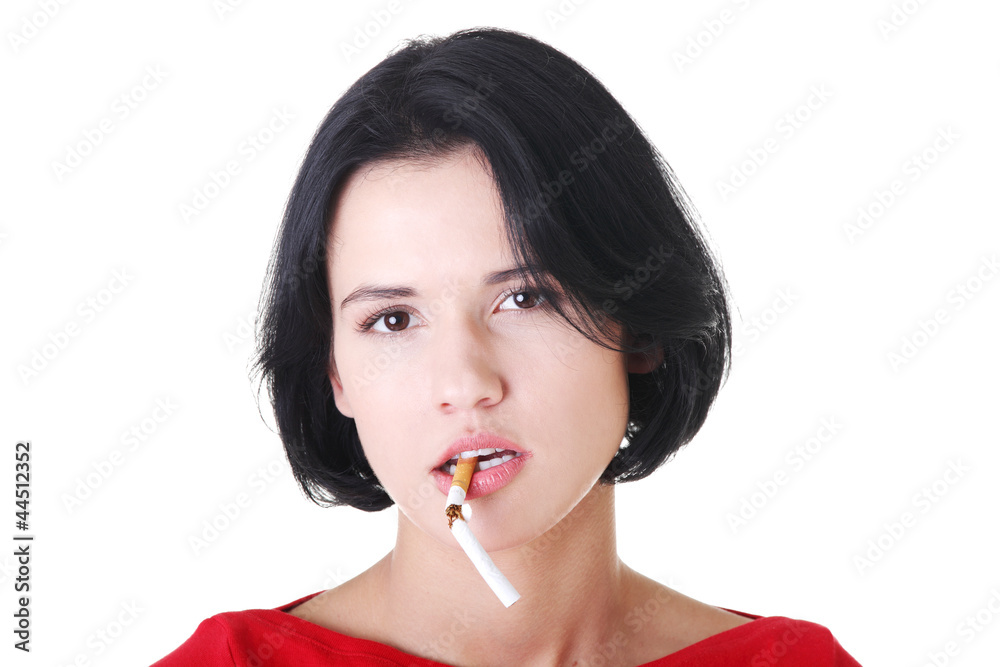 Young woman with broken cigarette. Young woman with broken cigarette.