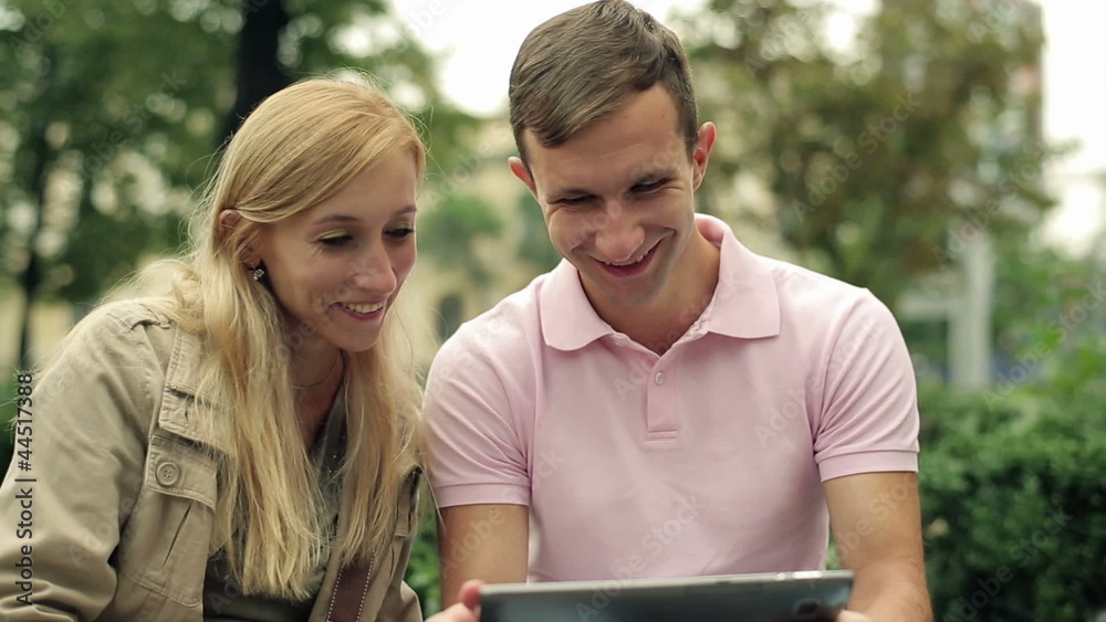 Young happy couple with tablet computer in the city Young happy couple with tablet computer in the city