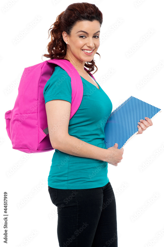 Side view of attractive smiling college girl Side view of attractive smiling college girl