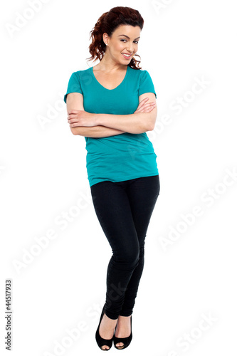 Cheerful woman posing with her hands crossed © stockyimages