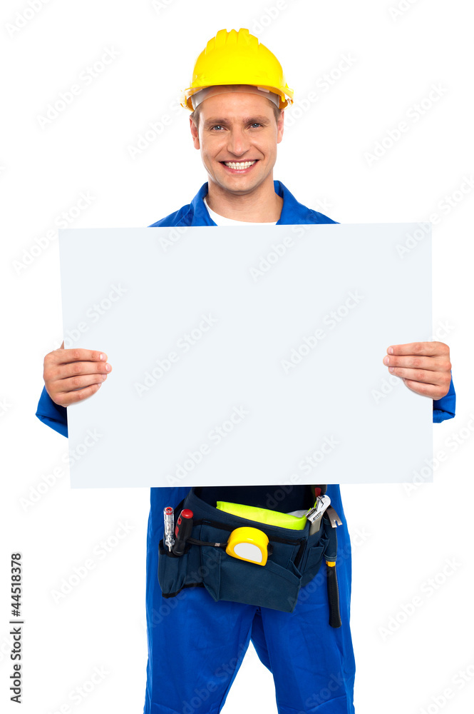 Construction worker holding blank billboard Construction worker holding blank billboard