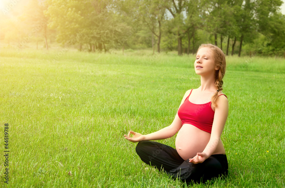 pregnant woman meditating in nature, practice yoga pregnant woman meditating in nature, practice yoga