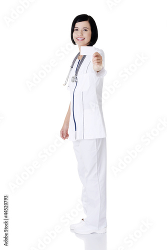 Woman doctor or nurse holding business card