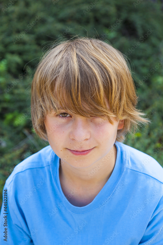 smart boy sitting on a bench