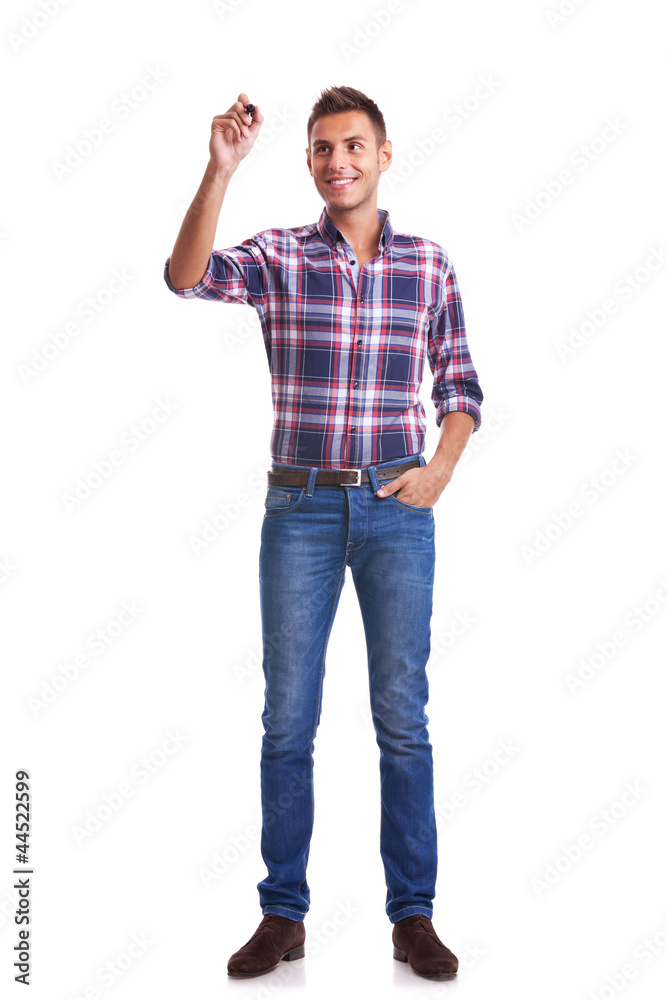 young casual man writing something with marker young casual man writing something with marker