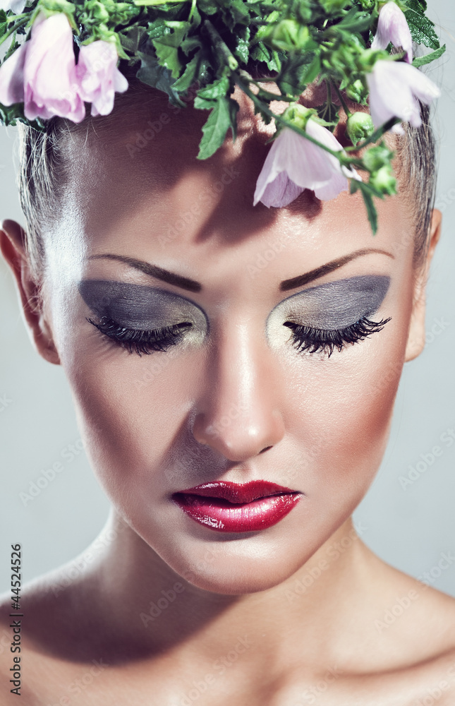 beautiful woman with flowers. makeup beautiful woman with flowers. makeup