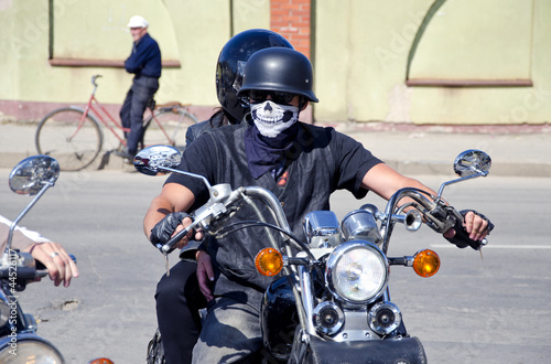 biker with mask on motorcycle © Alis Photo