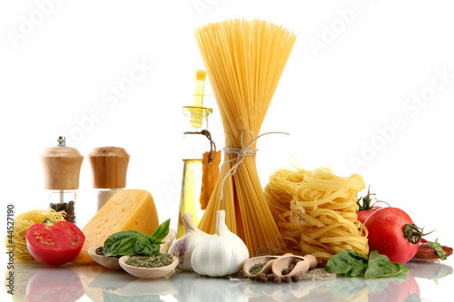 Pasta spaghetti, vegetables, spices and oil, isolated on white