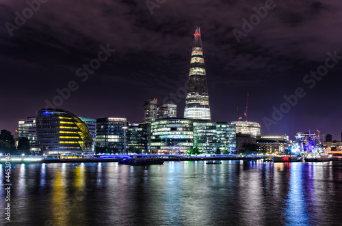 London skyline with lights reflecting from the Thames River