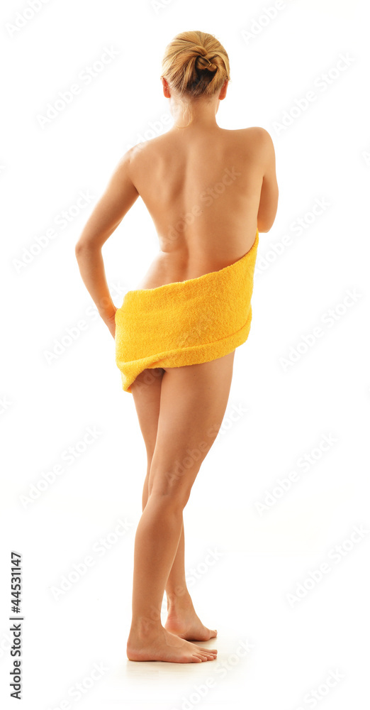 Fototapeta premium Nude woman with the towel isolated on white