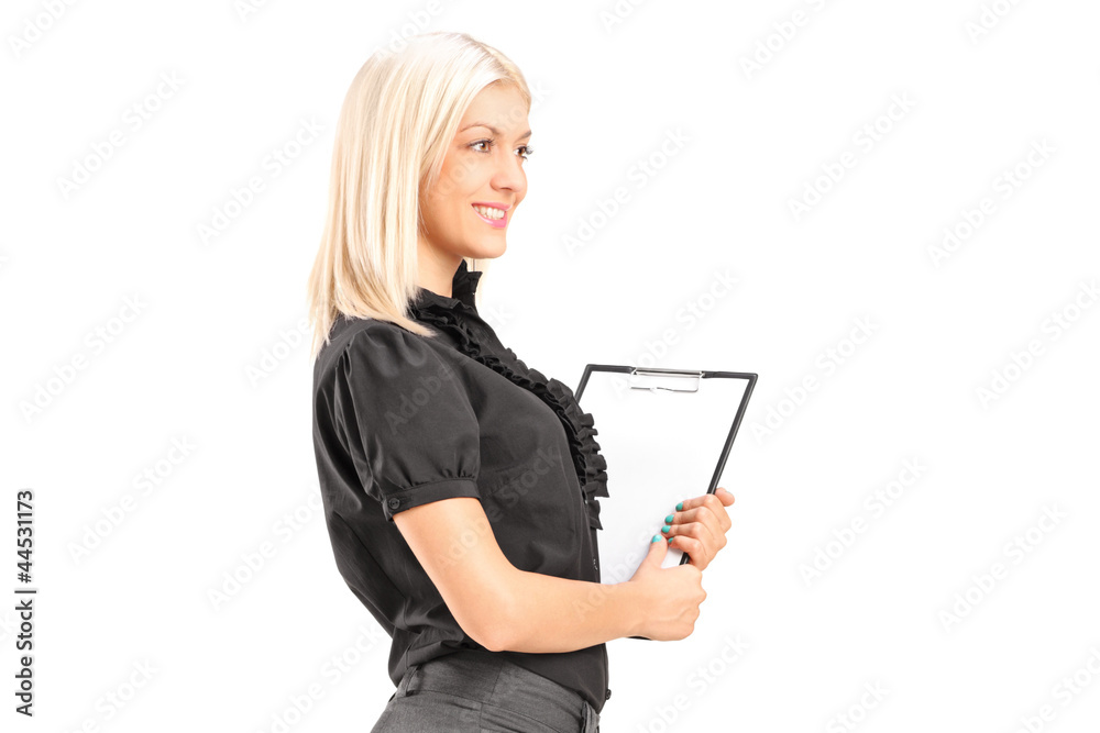 A young professional woman holding a clipboard A young professional woman holding a clipboard