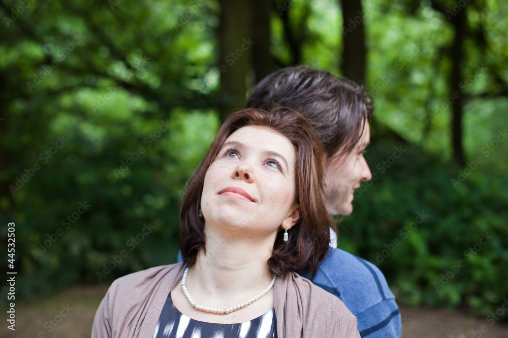 Young beautiful woman and man in summer forest Young beautiful woman and man in summer forest