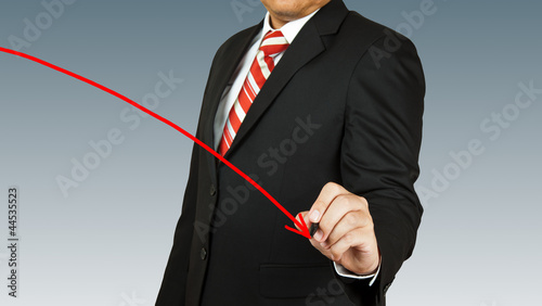 businessman hand drawing chart red arrow